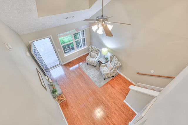 2039 Caladonia Way, Smyrna, TN 37167 - living room with visible vents, wood finished floors, lofted ceiling, baseboards, and ceiling fan