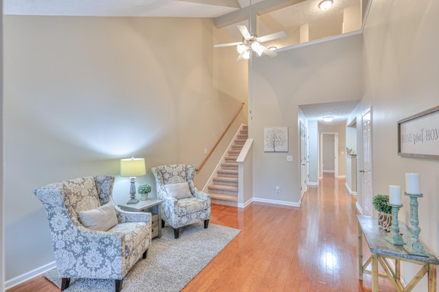 2039 Caladonia Way, Smyrna, TN 37167 - living area with a ceiling fan, wood finished floors, stairway, high vaulted ceiling, and beamed ceiling