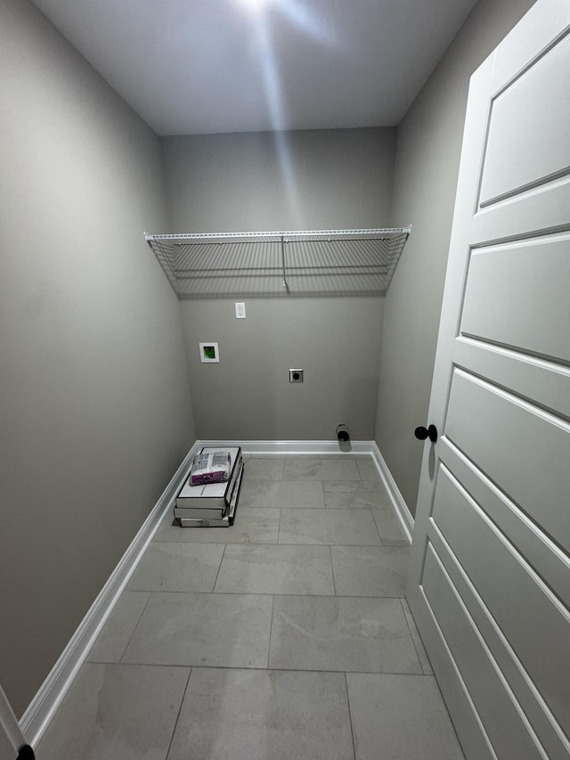 washroom featuring laundry area, electric dryer hookup, baseboards, hookup for a washing machine, and marble finish floor