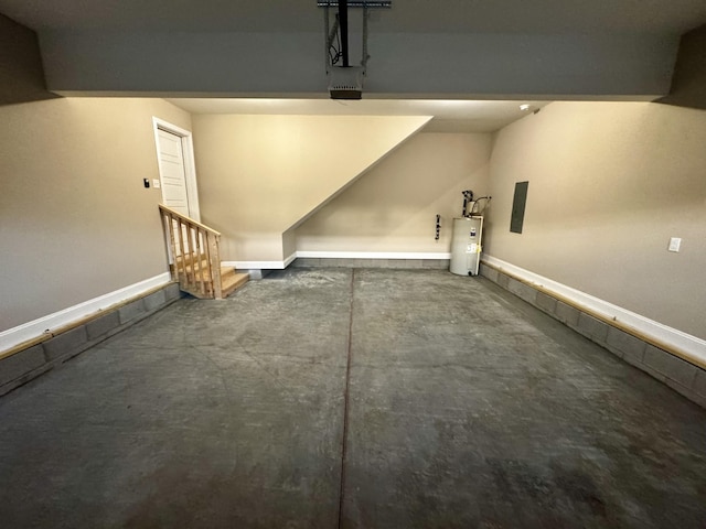 garage with water heater, baseboards, and a garage door opener