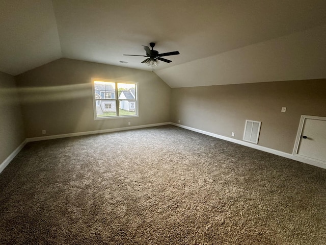 bonus room featuring carpet flooring, baseboards, visible vents, and lofted ceiling