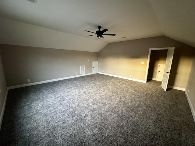 bonus room with visible vents, ceiling fan, vaulted ceiling, and dark colored carpet