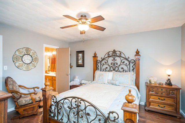 bedroom featuring a ceiling fan, dark wood finished floors, and ensuite bath