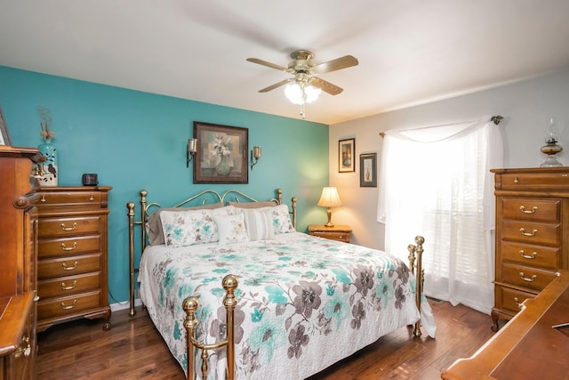 bedroom featuring a ceiling fan and wood finished floors