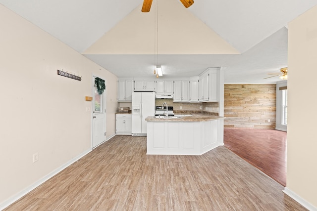 kitchen with ceiling fan, white refrigerator with ice dispenser, under cabinet range hood, and light wood-style flooring