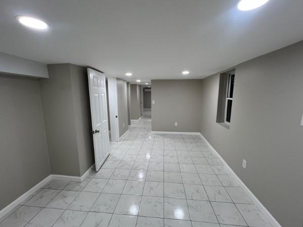 finished below grade area with recessed lighting and baseboards