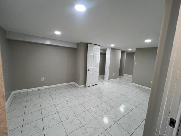 finished basement with recessed lighting and baseboards