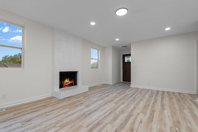 846 Forrest Glen Dr, Old Hickory, TN 37138 - unfurnished living room featuring light wood-style floors, recessed lighting, and a fireplace
