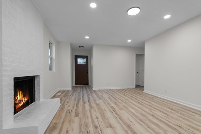 846 Forrest Glen Dr, Old Hickory, TN 37138 - unfurnished living room with light wood-type flooring, recessed lighting, baseboards, and a brick fireplace