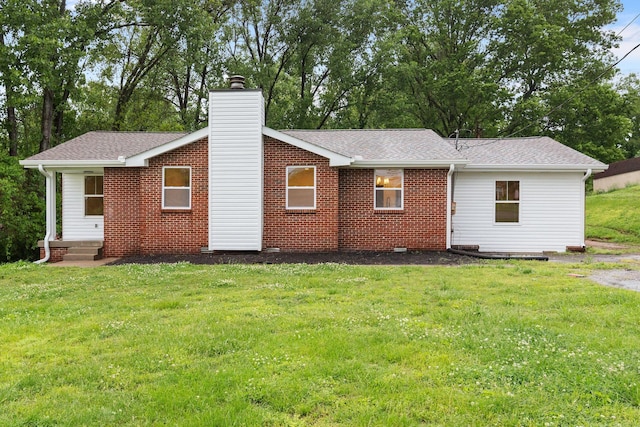 846 Forrest Glen Dr, Old Hickory, TN 37138 - back of house with a lawn, a chimney, a shingled roof, and brick siding