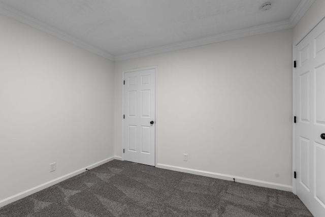 846 Forrest Glen Dr, Old Hickory, TN 37138 - spare room featuring dark colored carpet, baseboards, and crown molding