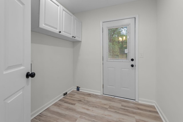 846 Forrest Glen Dr, Old Hickory, TN 37138 - clothes washing area featuring cabinet space, baseboards, and light wood-style floors