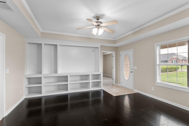 entryway with ceiling fan, baseboards, visible vents, ornamental molding, and hardwood / wood-style flooring