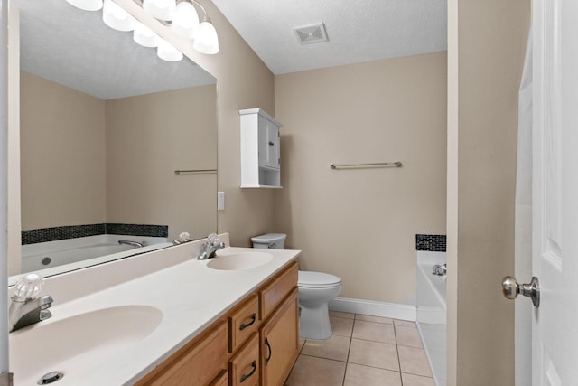 bathroom with a sink, tile patterned flooring, a garden tub, and visible vents