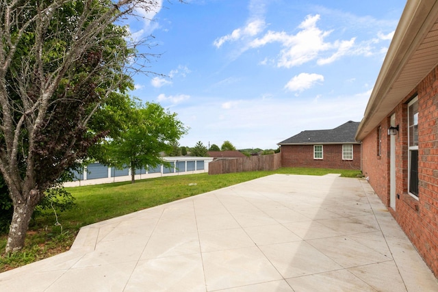 view of patio featuring fence