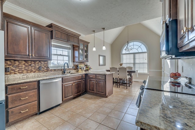 kitchen featuring a peninsula, light tile patterned flooring, tasteful backsplash, a sink, and stainless steel appliances