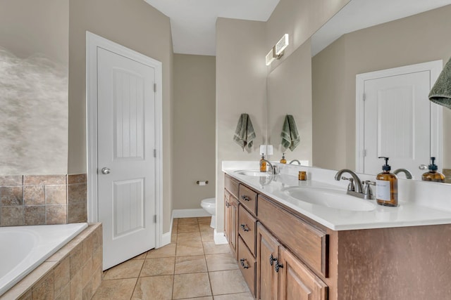 full bathroom with a relaxing tiled tub, a sink, double vanity, and toilet