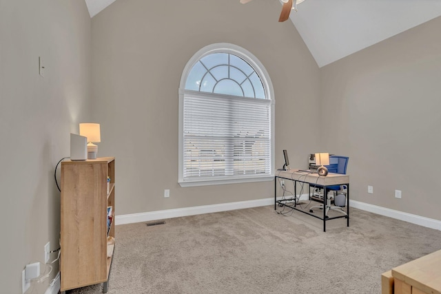 office featuring carpet floors, a ceiling fan, visible vents, and plenty of natural light