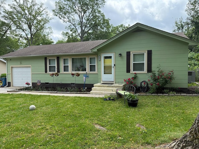 single story home with an attached garage, a shingled roof, a front yard, and crawl space