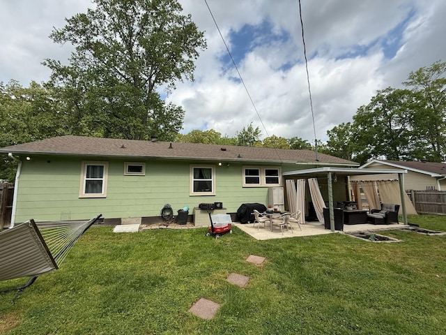 rear view of house with a yard, a patio, fence, and an outdoor living space