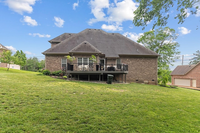 back of house featuring roof with shingles, brick siding, a deck, crawl space, and a lawn