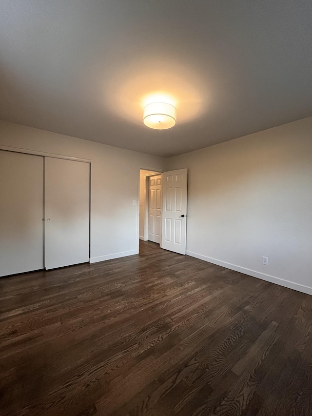 361 Binkley Dr, Nashville, TN 37211 - unfurnished bedroom featuring baseboards, dark wood finished floors, and a closet