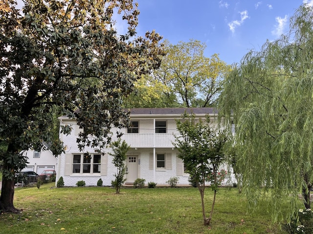 361 Binkley Dr, Nashville, TN 37211 - view of front of property featuring a balcony, a front yard, and brick siding