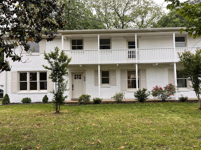 361 Binkley Dr, Nashville, TN 37211 - view of front of home featuring brick siding, a balcony, and a front lawn