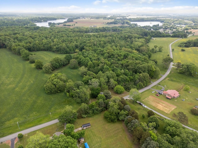 birds eye view of property with a water view and a rural view