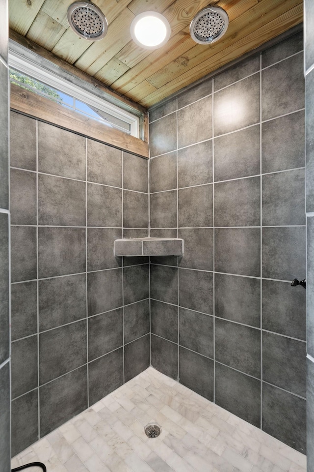 full bathroom with wooden ceiling and a tile shower