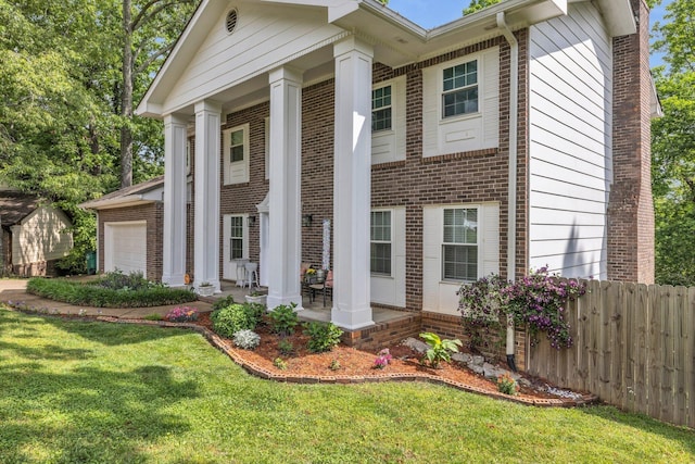 1204 Wood Pines Ln, Hixson, TN 37343 - greek revival inspired property with brick siding and a garage