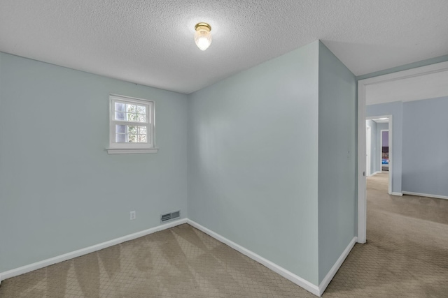 1204 Wood Pines Ln, Hixson, TN 37343 - carpeted spare room featuring baseboards and a textured ceiling