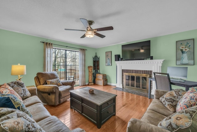 1204 Wood Pines Ln, Hixson, TN 37343 - living area featuring ceiling fan, a fireplace, and wood-type flooring