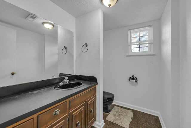1204 Wood Pines Ln, Hixson, TN 37343 - bathroom featuring vanity, baseboards, toilet, and a textured ceiling