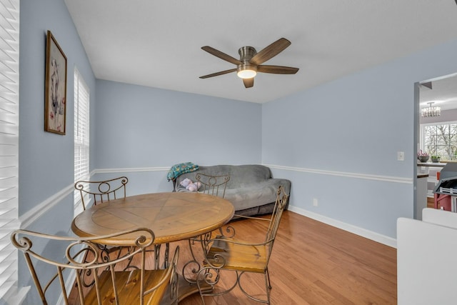 1204 Wood Pines Ln, Hixson, TN 37343 - dining room with a ceiling fan, wood finished floors, baseboards, and a chandelier