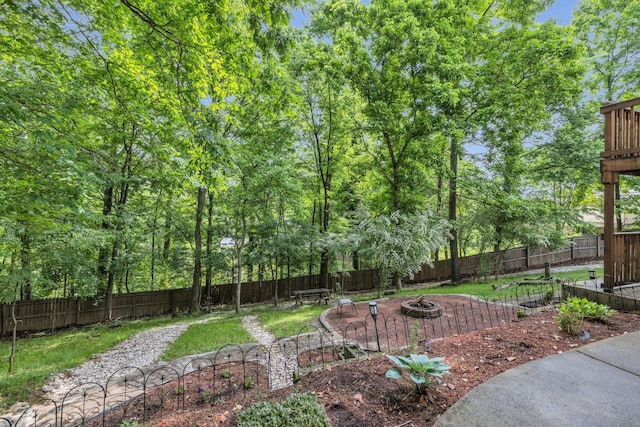 1204 Wood Pines Ln, Hixson, TN 37343 - fenced backyard featuring a fire pit and a patio area