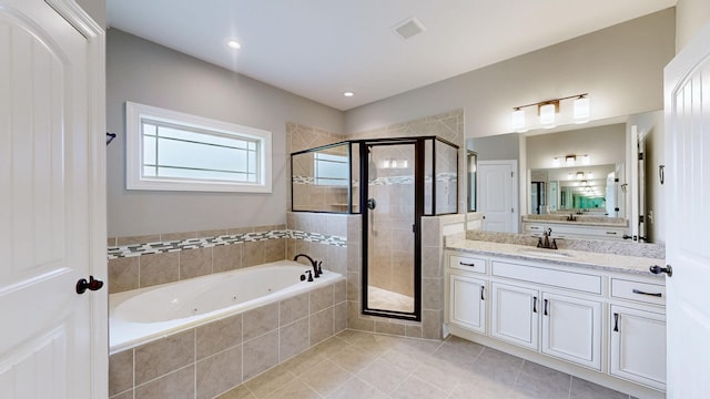 full bathroom featuring vanity, visible vents, tile patterned floors, a stall shower, and a jetted tub
