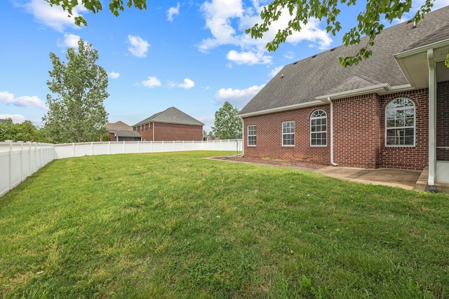 view of yard featuring a fenced backyard