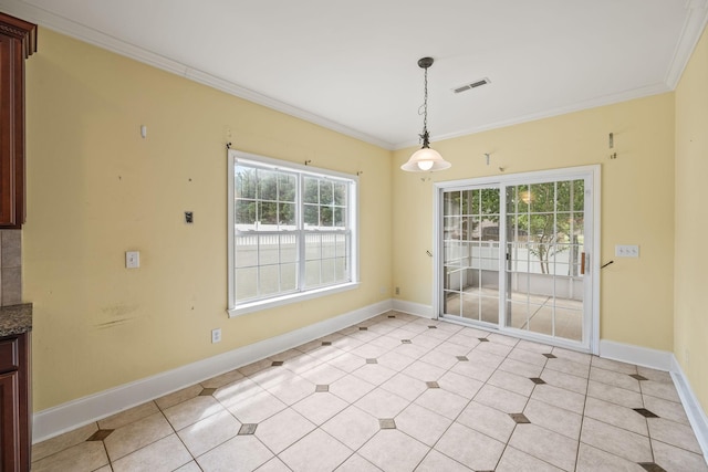 unfurnished dining area with visible vents, baseboards, and crown molding