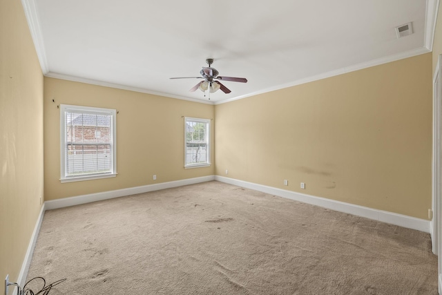unfurnished room featuring carpet flooring, a ceiling fan, baseboards, visible vents, and ornamental molding