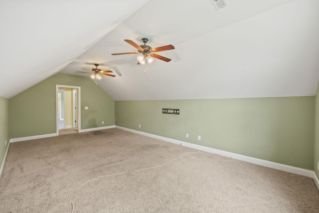 bonus room with ceiling fan, visible vents, vaulted ceiling, carpet floors, and baseboards