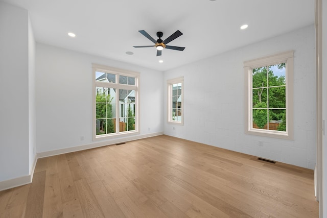 empty room with hardwood / wood-style flooring, ceiling fan, and recessed lighting