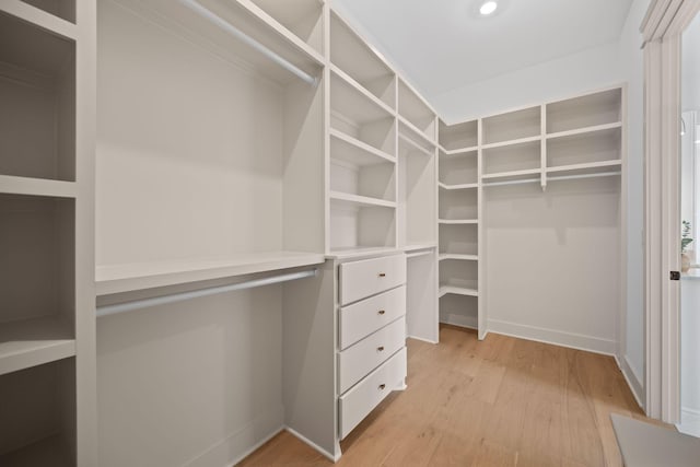 walk in closet featuring light wood-style flooring