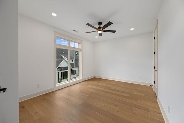 spare room with a ceiling fan, light wood finished floors, baseboards, and recessed lighting