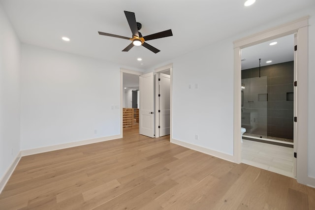 unfurnished bedroom featuring light wood-style floors, recessed lighting, baseboards, and ensuite bathroom