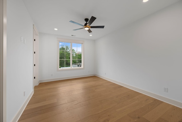 unfurnished room with light wood-style flooring, a ceiling fan, recessed lighting, and baseboards