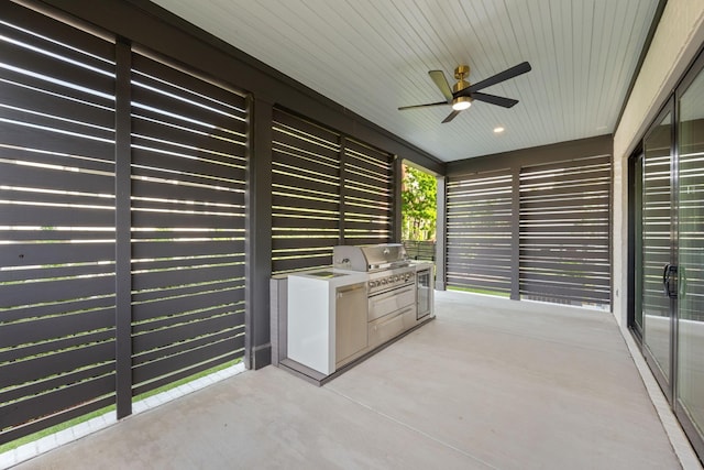view of patio / terrace with area for grilling, a ceiling fan, and grilling area