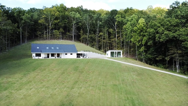 exterior space with a forest view