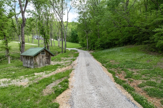 view of street with a forest view