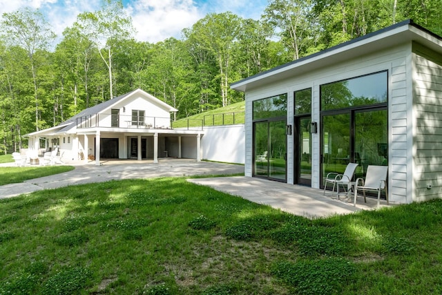 back of property with a patio, stairway, a yard, and a deck